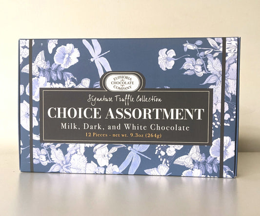 A box of Euphoria Chocolate Company truffles with a floral pattern on the packaging, labeled 'Choice Assortment' with options of milk, dark, and white chocolate in a 12-piece variety