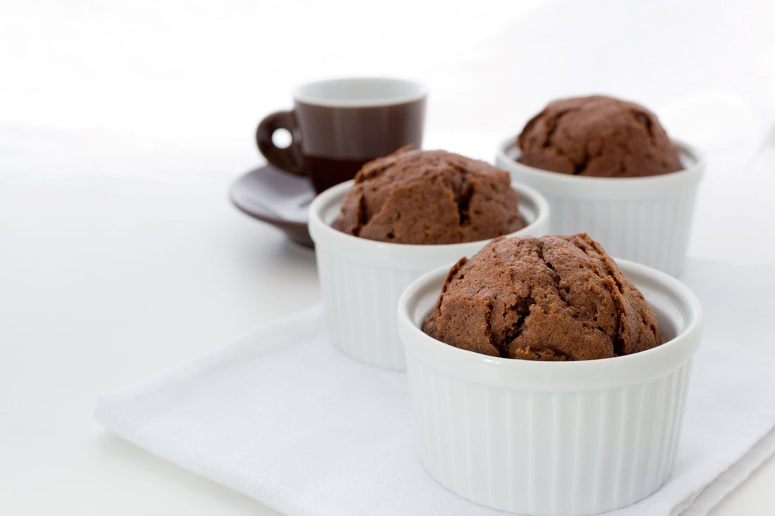 Chocolate mini-cakes in white porcelain ramekins.