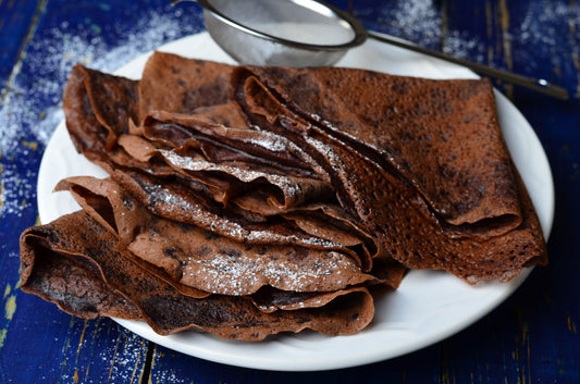 Shiny folded chocolate crepes.