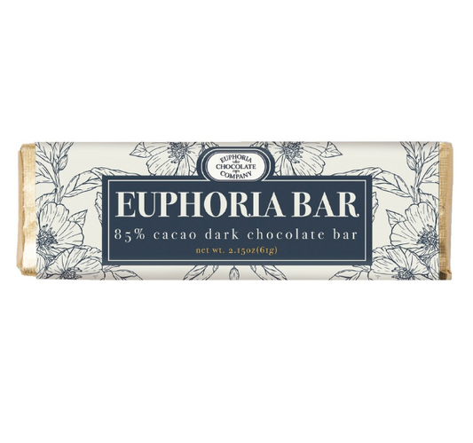 A Euphoria Chocolate Company 85% dark chocolate bar, with floral wrapper design and brand name displayed