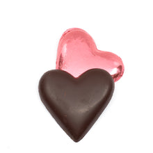 Load image into Gallery viewer, Two heart-shaped chocolates, one wrapped in pink foil and one made of dark chocolate, on a white background