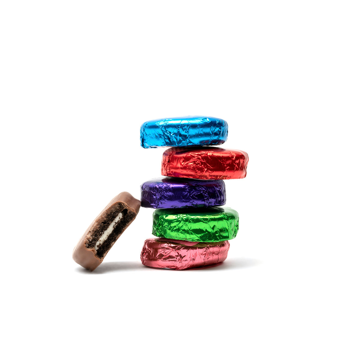 Stack of colorful foil-wrapped cookies on a white background