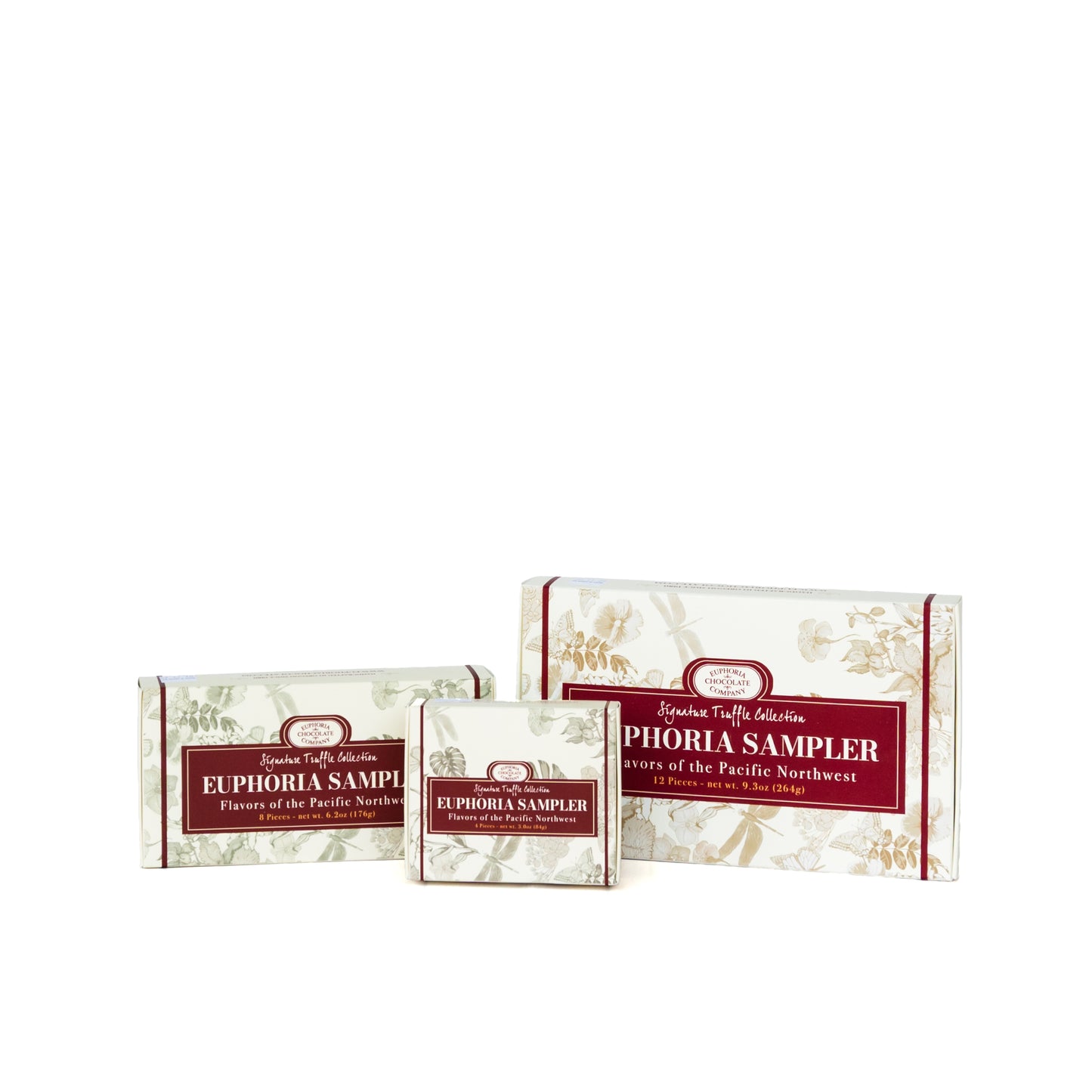 Three boxes of Euphoria Sampler truffles on a white background.