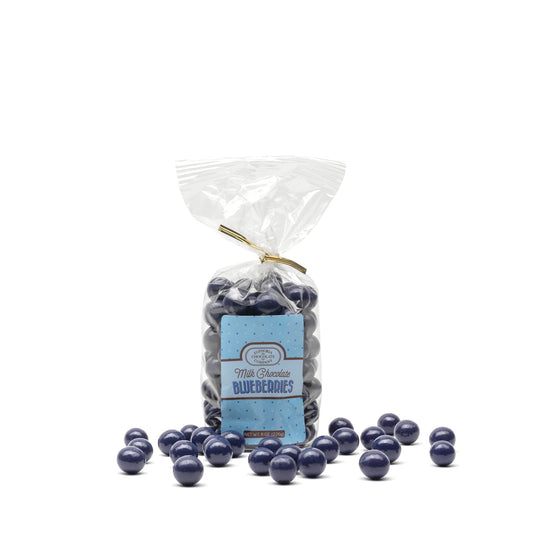 A zip-tied bag of Euphoria Chocolate Company milk chocolate blueberries on white background