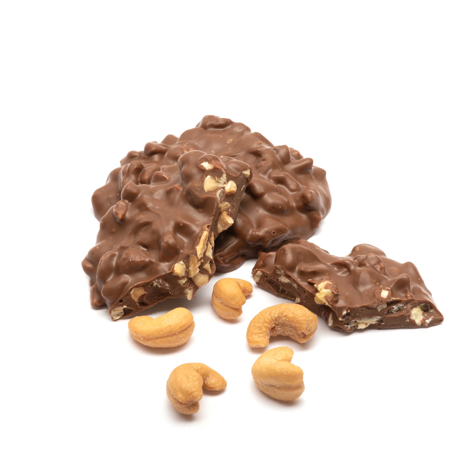 Milk chocolate-covered peanuts on a white background