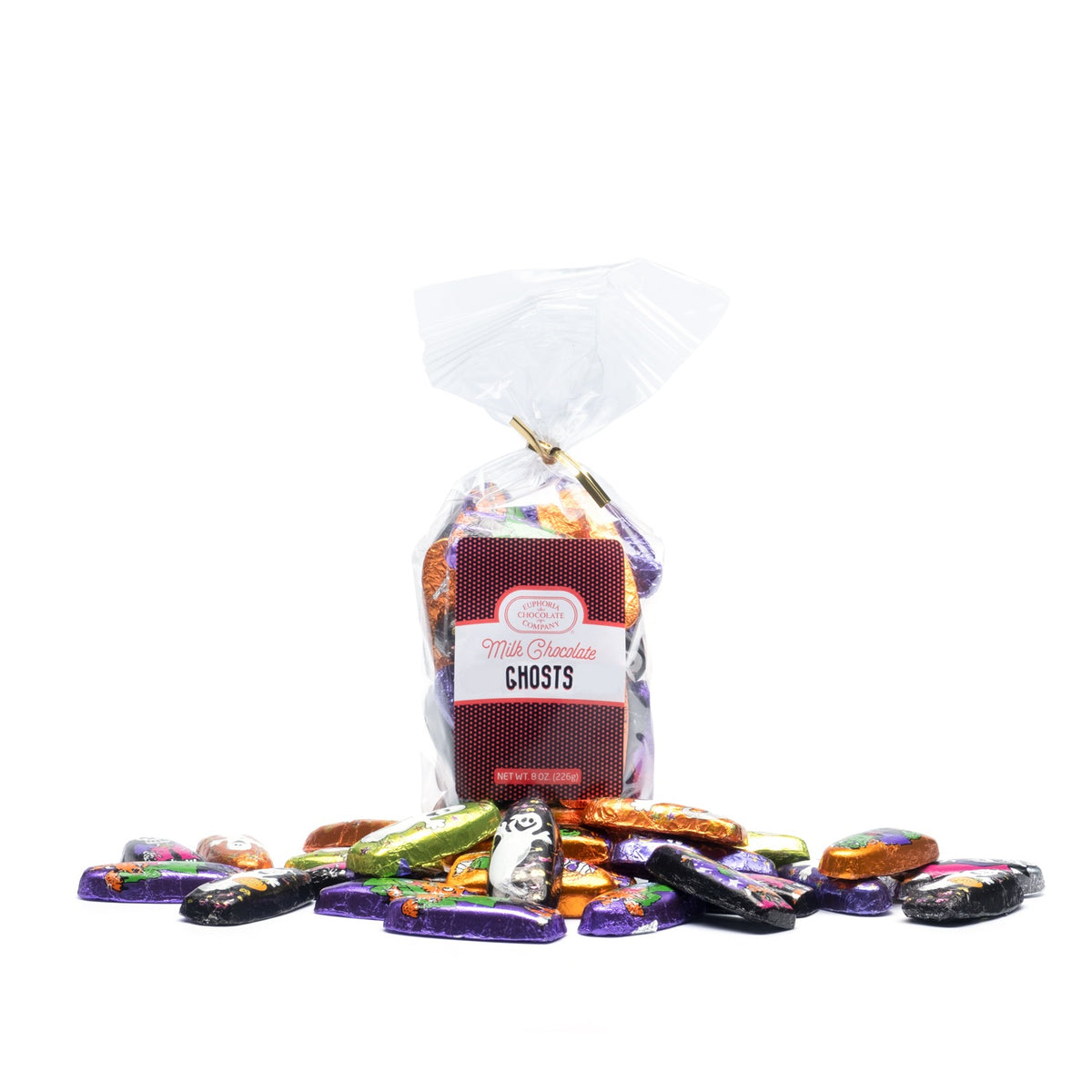 A clear plastic bag of Euphoria Chocolate Company Milk Chocolate Ghosts with a white and red label, standing upright on a white background with several colorful individually wrapped candies spilled in front.