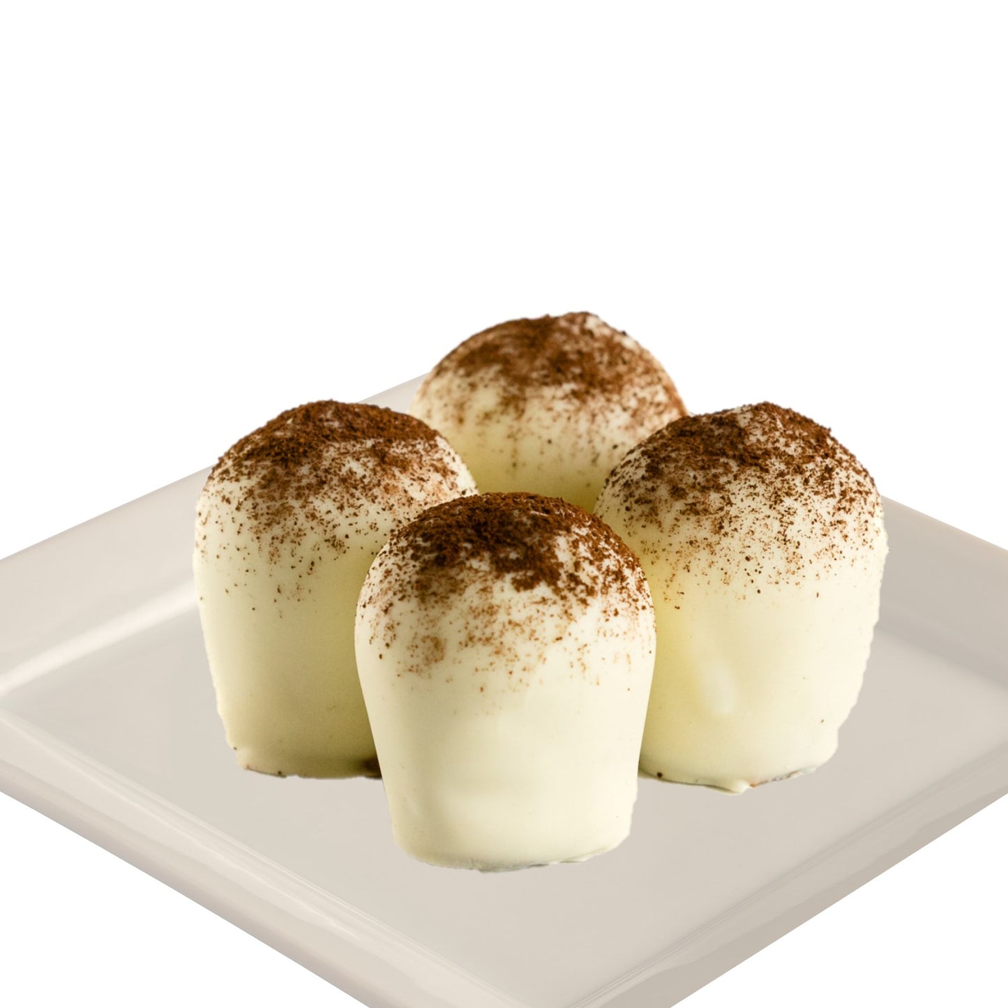 Four white chocolate Tiramisu truffles topped with brown cocoa powder, presented on a white plate on a white background