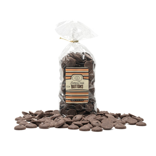 A clear plastic gift bag filled with extra dark chocolate buttons, with a brown Euphoria Chocolate Company label that reads 'Extra Dark Buttons' presented against a white background.