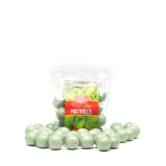 A bag of mint chip maltballs with a Euphoria Chocolate Company label against a white background and loose maltballs surrounding the bag.