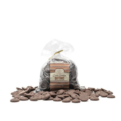 A resealable plastic bag filled with dark chocolate buttons, with a label showing the Euphoria Chocolate Company brand and the product name. Additional chocolate buttons are scattered in front of the bag against a white background.